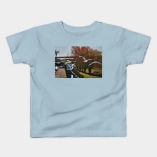 Sitting on the fence Kids T-Shirt